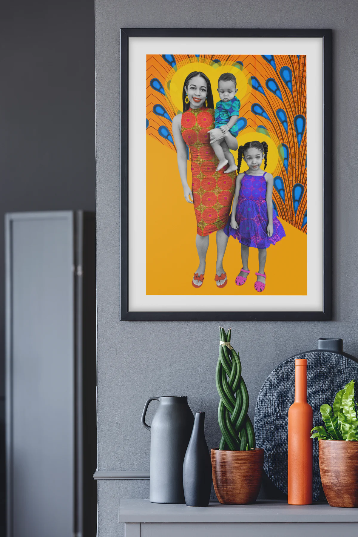 Framed Frequency of Love family portrait displayed on a dark grey wall in a contemporary interior.